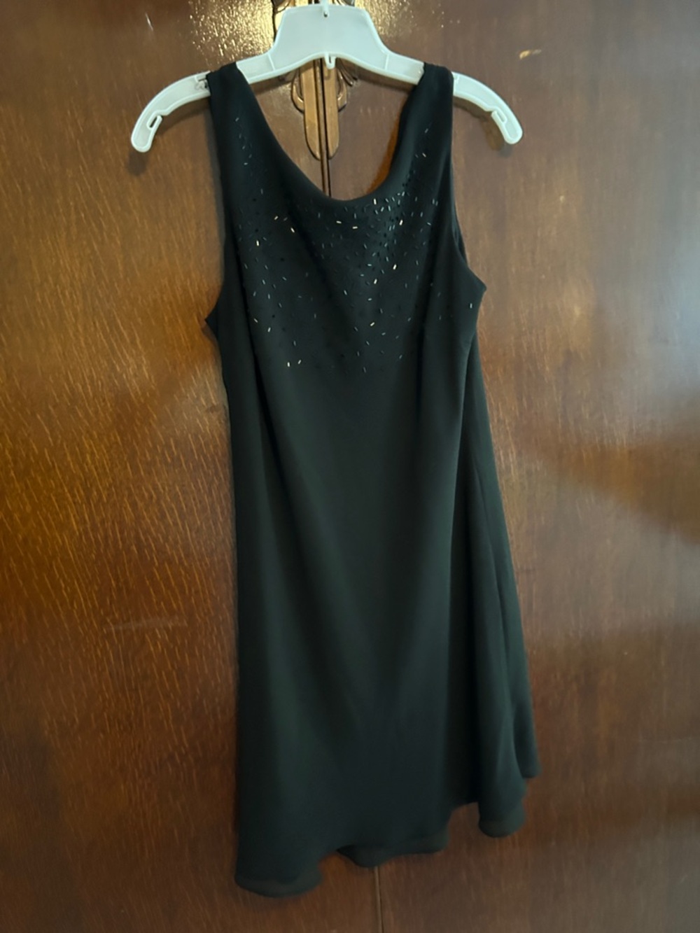Black Sleeveless Mini Dress with Subtle Neckline Embellishment